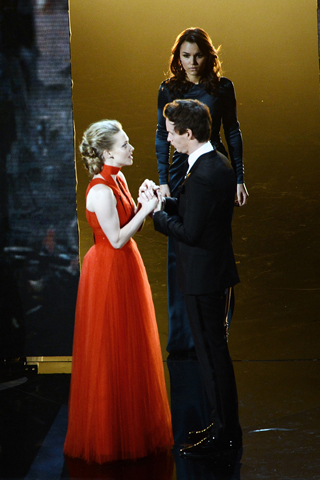 Amanda Seyfried, in Givenchy Haute Couture, and Eddie Redmayne, in Burberry Prorsum.